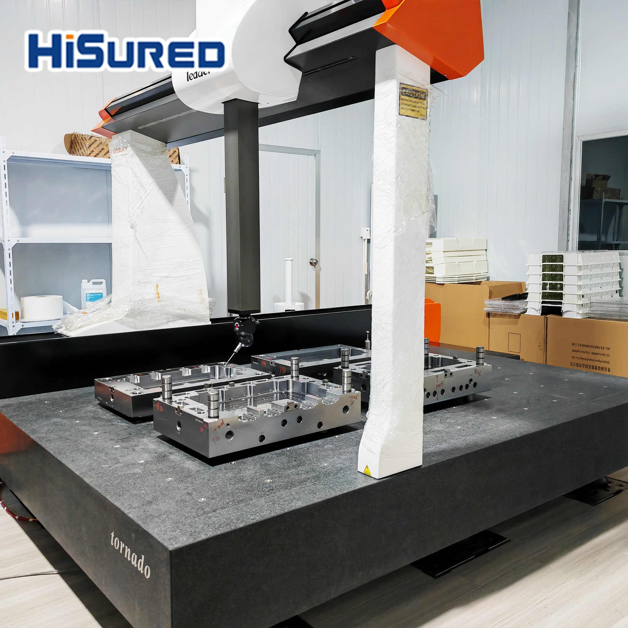 Coordinate measuring machine probing mold base components on a granite inspection table